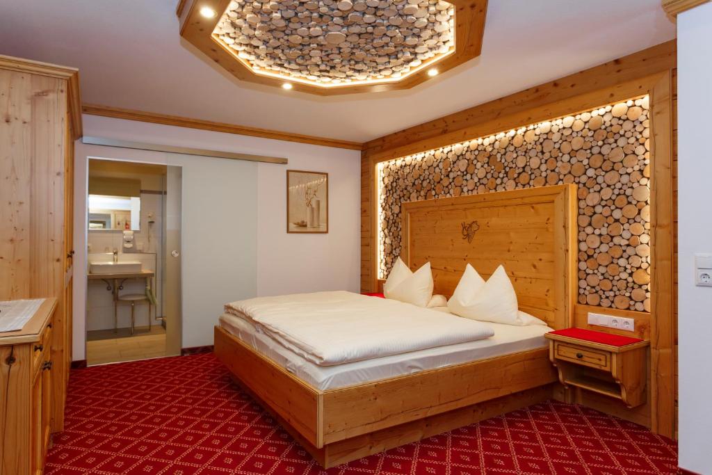 Postel nebo postele na pokoji v ubytování Hotel Gondel