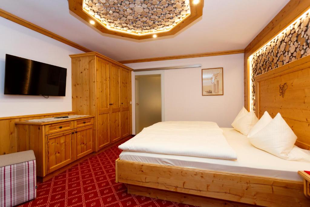 Postel nebo postele na pokoji v ubytování Hotel Gondel