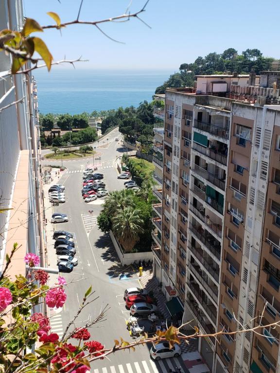 a view of a parking lot with cars in a parking lot at Apart.3 habit.mar-mont. AC-Terraza-ascensor-parking in Calella