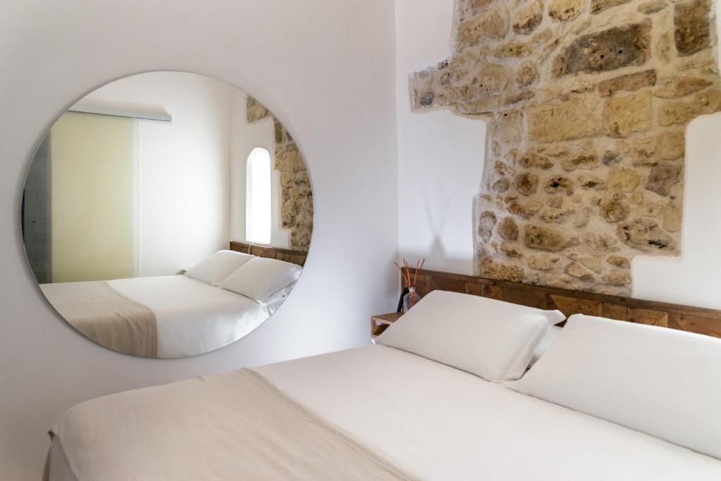 Postel nebo postele na pokoji v ubytování Palazzo Sant'Anna Lecce