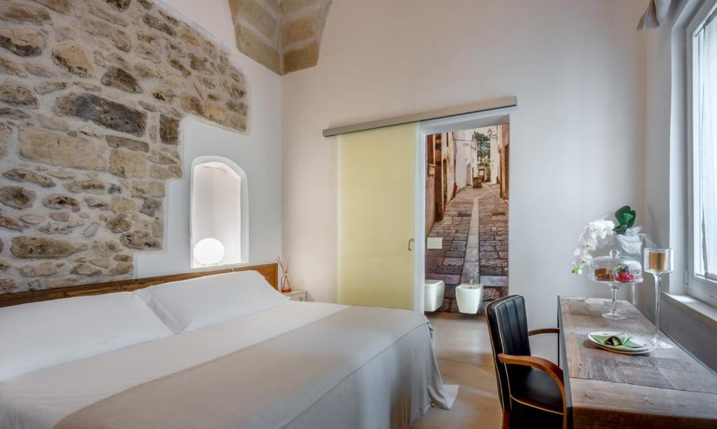 Postel nebo postele na pokoji v ubytování Palazzo Sant'Anna Lecce