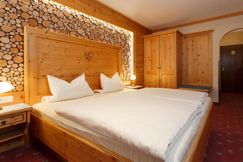 Postel nebo postele na pokoji v ubytování Hotel Gondel