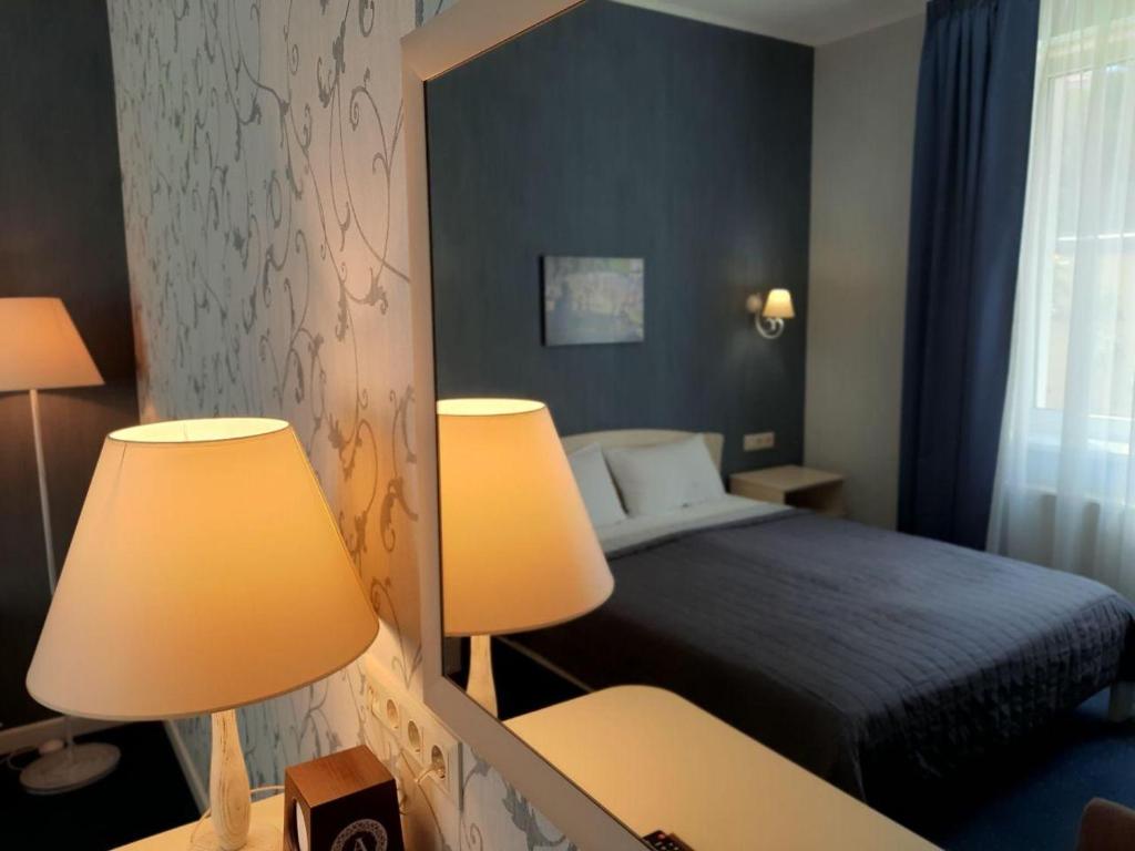 Postel nebo postele na pokoji v ubytování Hotel Ajur