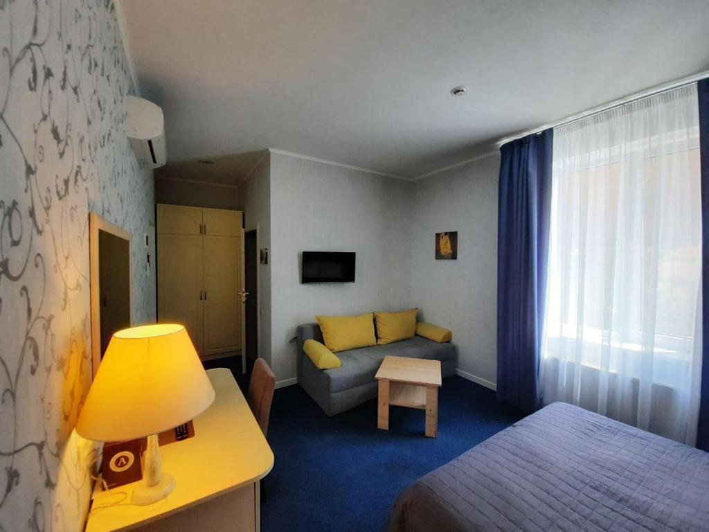 Postel nebo postele na pokoji v ubytování Hotel Ajur