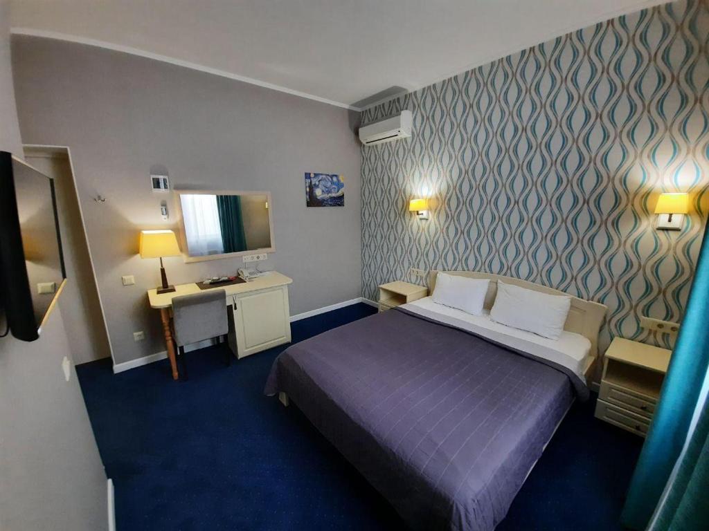 Postel nebo postele na pokoji v ubytování Hotel Ajur