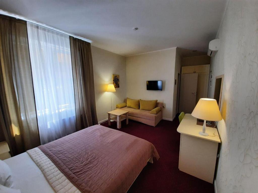 Postel nebo postele na pokoji v ubytování Hotel Ajur