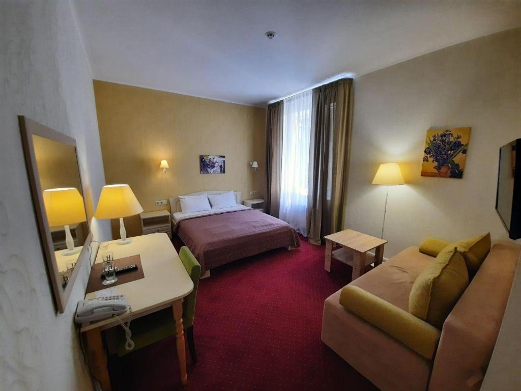 Postel nebo postele na pokoji v ubytování Hotel Ajur