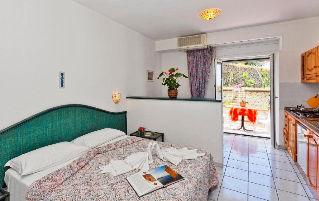 Letto o letti in una camera di Parco Residence La Rosa