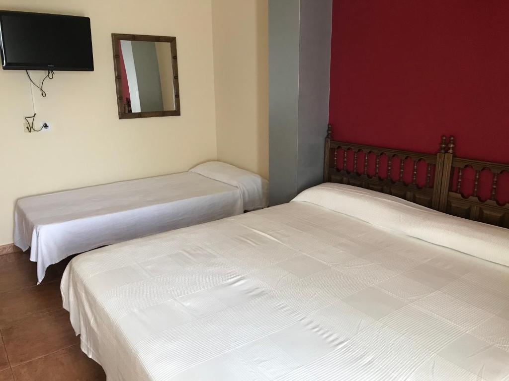 Postel nebo postele na pokoji v ubytování El Pradón
