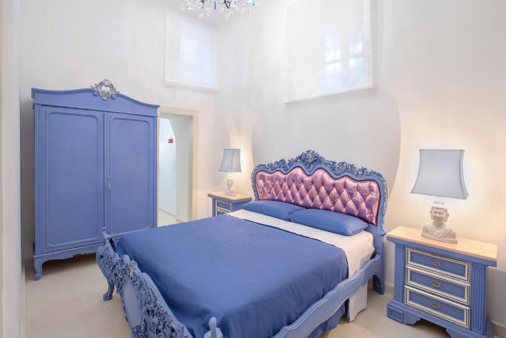 A bed or beds in a room at à Marchisa -Noto-