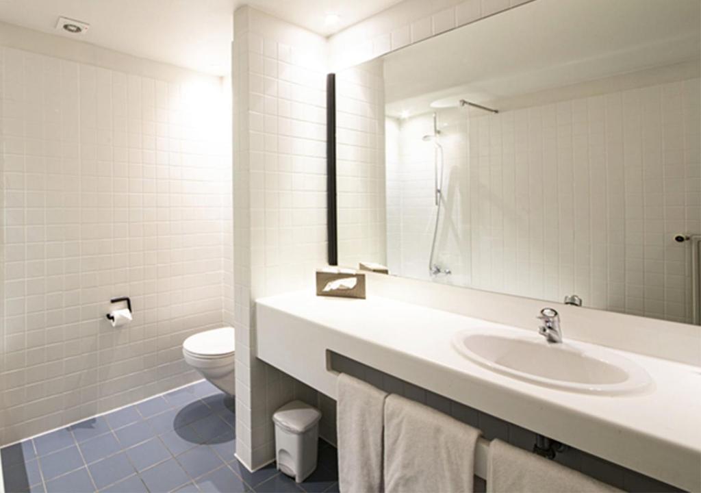 Koupelna v ubytování Hotel Cortina