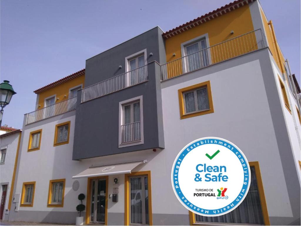 a building with a sign that says clean and safe at Barquinha Nature House in Vila Nova da Barquinha