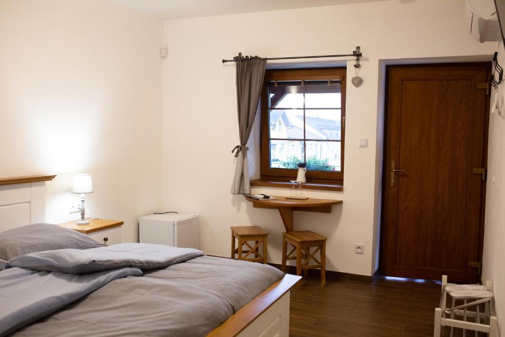 Postel nebo postele na pokoji v ubytování Penzion BLATNICE