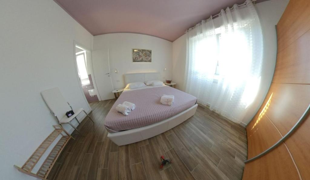 Postel nebo postele na pokoji v ubytování B&b Angolo 29