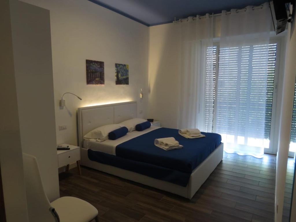 Postel nebo postele na pokoji v ubytování B&b Angolo 29