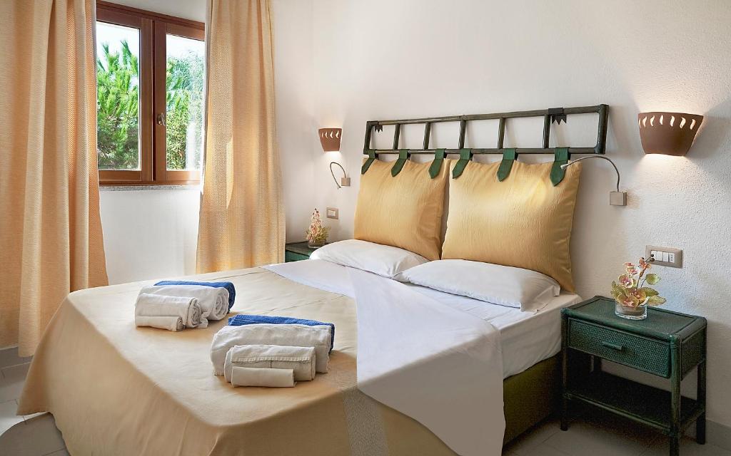Postel nebo postele na pokoji v ubytování Resort & SPA Le Dune