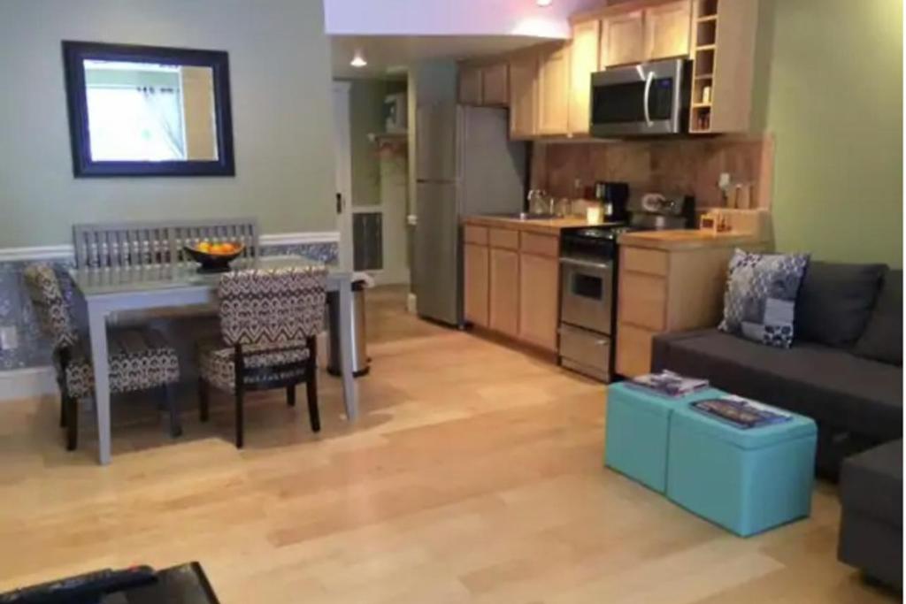 a kitchen and living room with a couch and a table at Happy Thoughts in Telluride