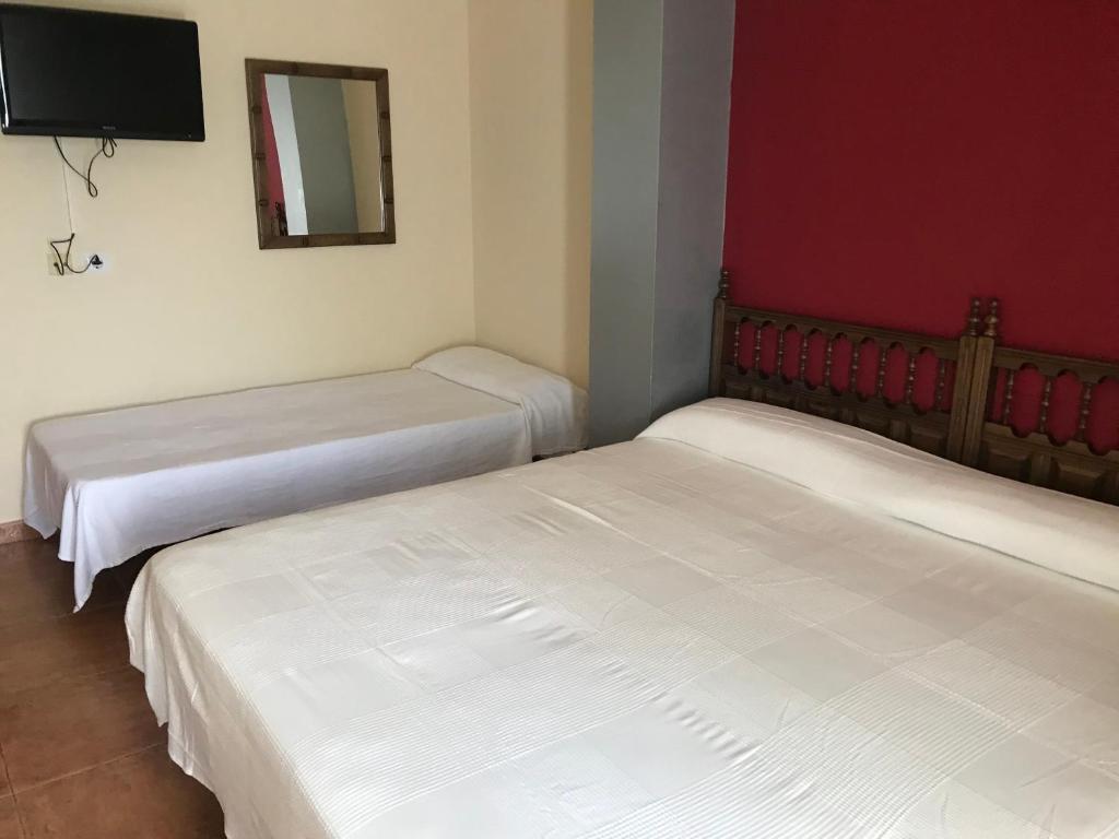 Postel nebo postele na pokoji v ubytování El Pradón