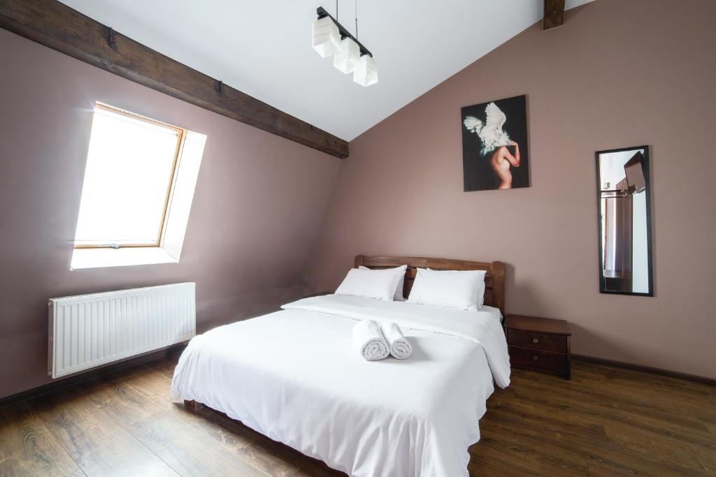 Postel nebo postele na pokoji v ubytování Aparthotel Na Mytniy