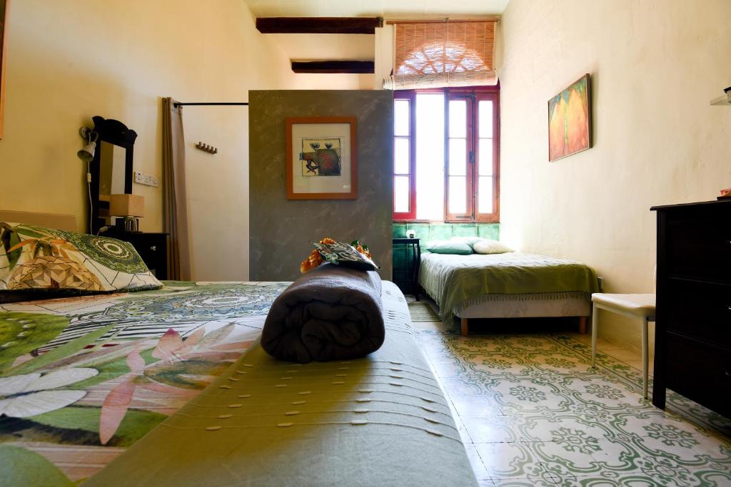 Postel nebo postele na pokoji v ubytování Charming B&B Dar Ta Zeppi