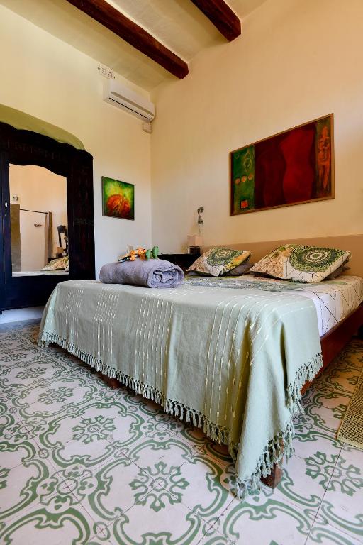 Postel nebo postele na pokoji v ubytování Charming B&B Dar Ta Zeppi
