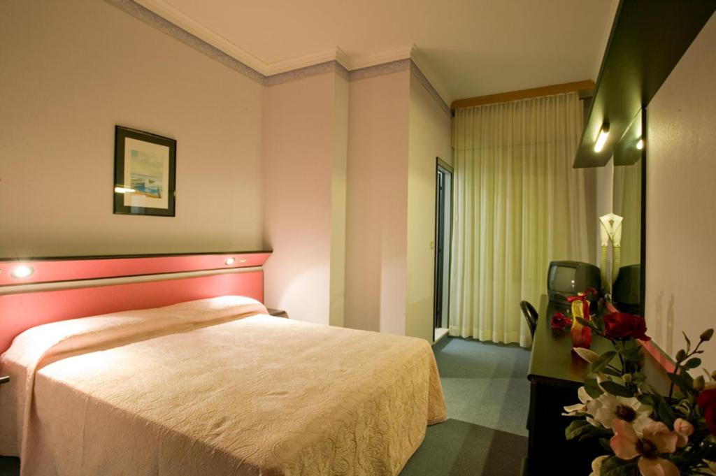 Postel nebo postele na pokoji v ubytování Hotel Ida