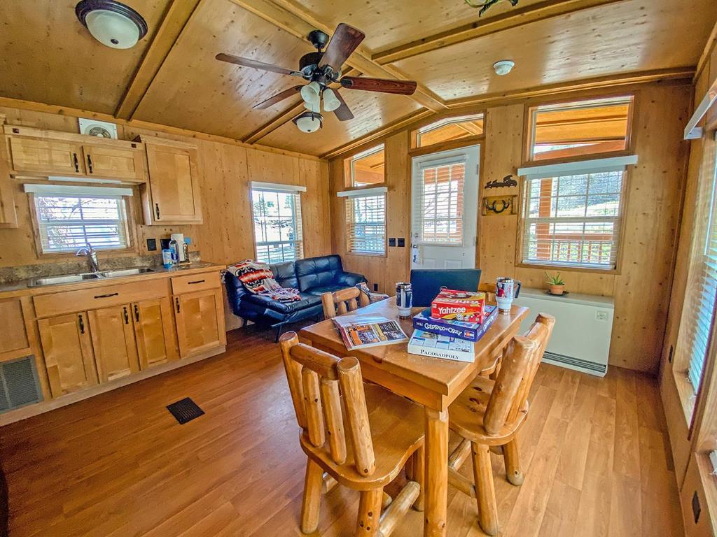 a kitchen and dining room with a table and chairs at Healing Waters Resort and Spa in Pagosa Springs