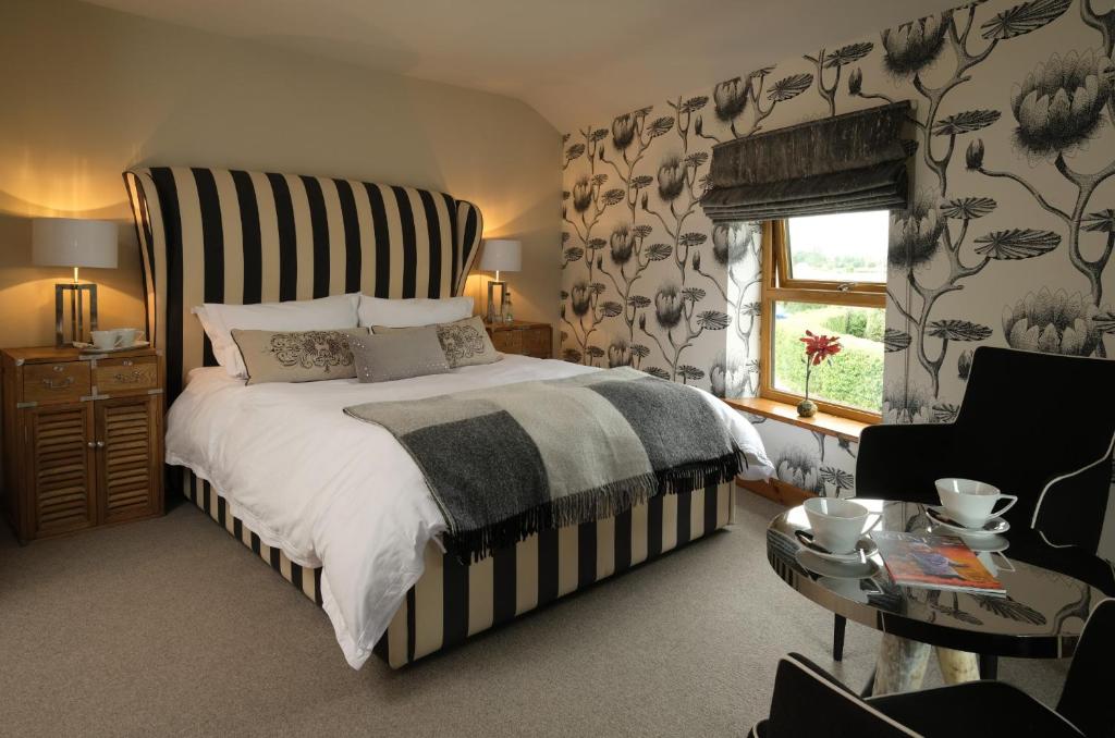Ένα ή περισσότερα κρεβάτια σε δωμάτιο στο The Queens At Horton