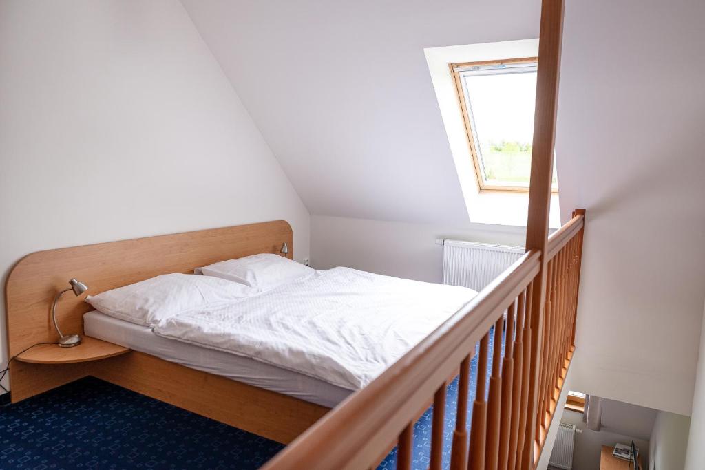 Postel nebo postele na pokoji v ubytování Apartmány Engadin