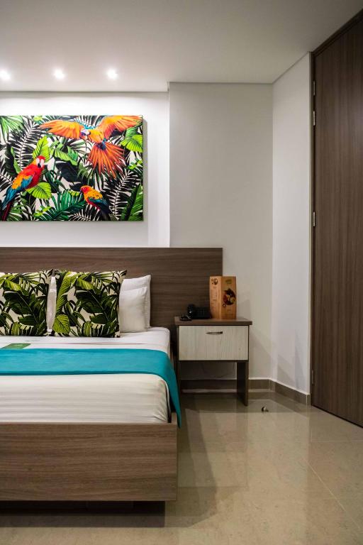 Postel nebo postele na pokoji v ubytování Lleras Green Hotel