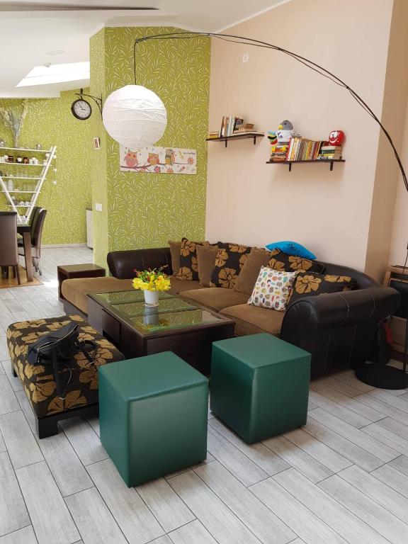 a living room with a couch and a table at Apartment Sovica in Belgrade