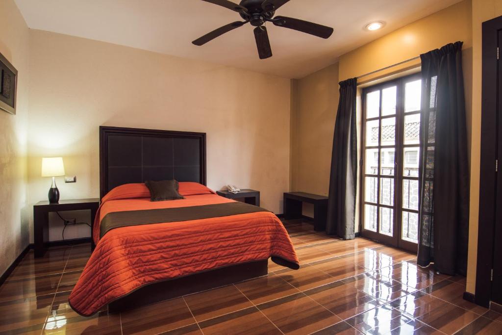 Postel nebo postele na pokoji v ubytování Hotel Majova Inn Xalapa