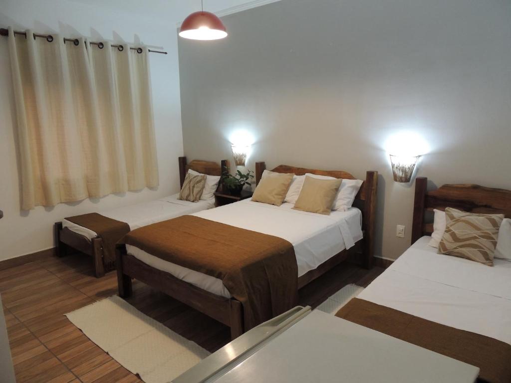 Een bed of bedden in een kamer bij Hotel Novo Horizonte - By UP Hotel