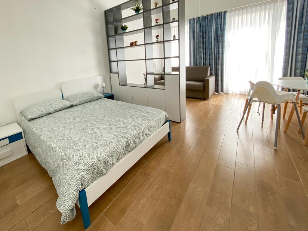 Posteľ alebo postele v izbe v ubytovaní Appartamento a 30 mt dal mare