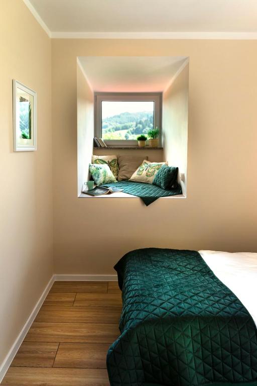 Postel nebo postele na pokoji v ubytování Apartamenty Willove Wzgórze