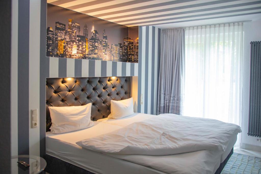 Postel nebo postele na pokoji v ubytování SL'otel im Parforcehaus