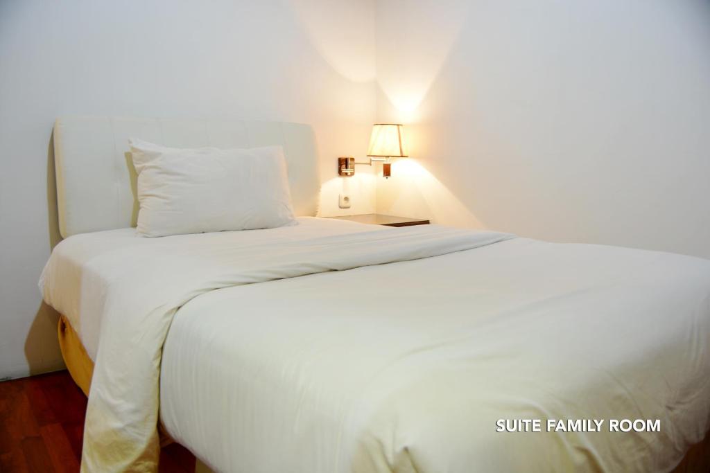Postel nebo postele na pokoji v ubytování Kasira Residence