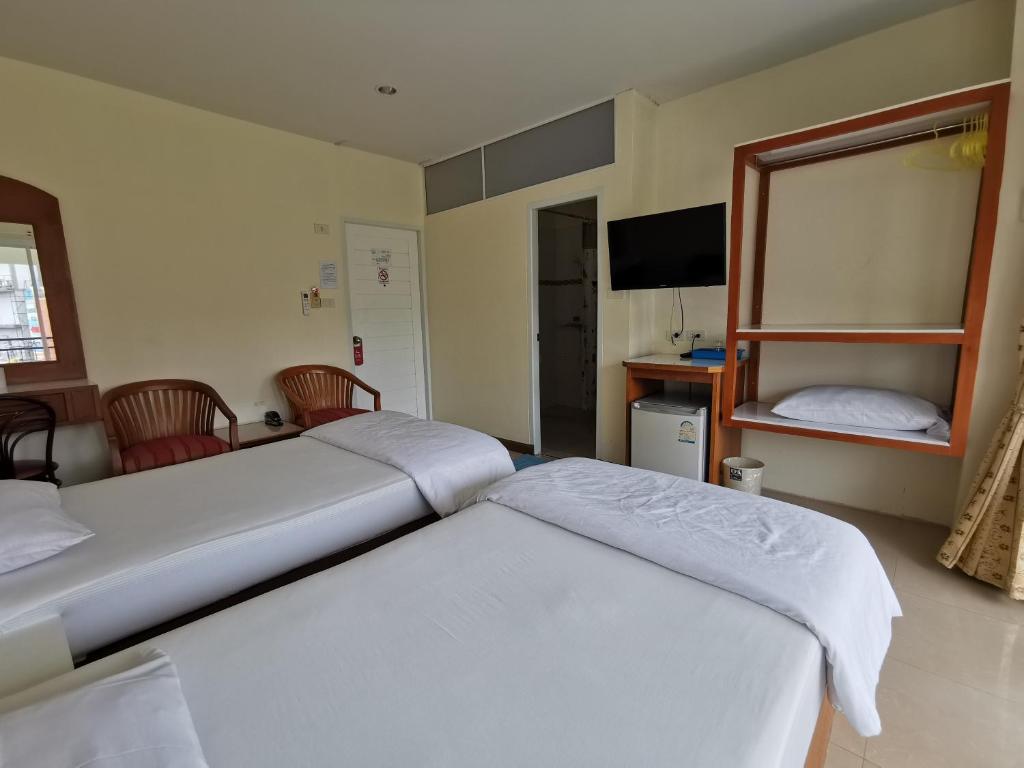 Postel nebo postele na pokoji v ubytování Subhamitra Hotel Hua Hin-SHA Certified