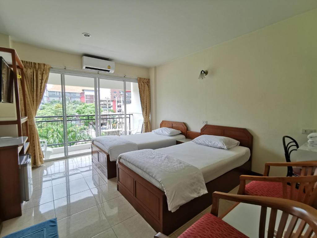 Postel nebo postele na pokoji v ubytování Subhamitra Hotel Hua Hin-SHA Certified
