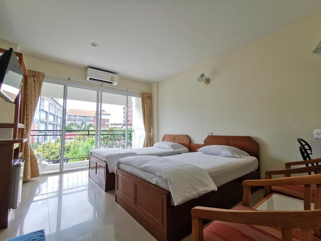 Postel nebo postele na pokoji v ubytování Subhamitra Hotel Hua Hin-SHA Certified
