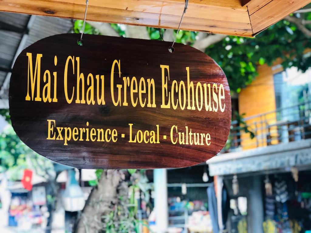 Hòa Bình的住宿－Mai Chau Green Ecohouse，读到近海禅宗绿色叶的标志体验当地文化