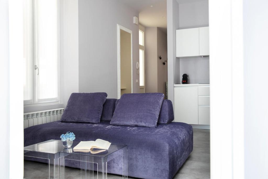 A seating area at CHARMING MOMENT di Villa Porta - Residenza Porto Vecchio