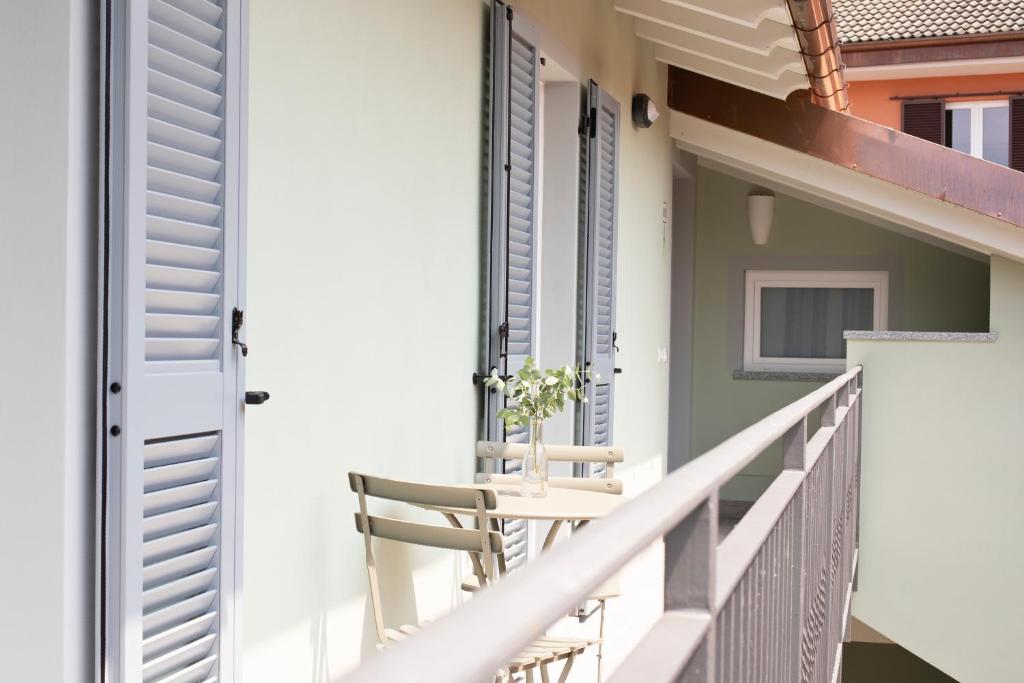 A balcony or terrace at CHARMING MOMENT di Villa Porta - Residenza Porto Vecchio