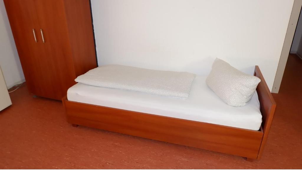 Postel nebo postele na pokoji v ubytování Hostel am Kurtti
