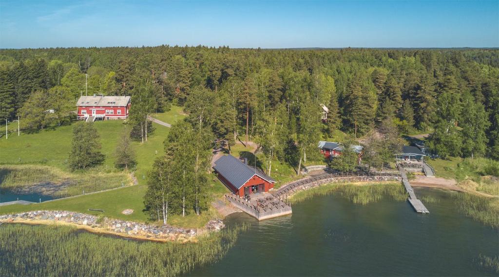 an aerial view of a house on an island in the water at Calliola kokous- ja saaristohotelli in Snappertuna