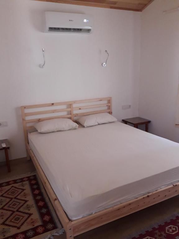 Postel nebo postele na pokoji v ubytování Bungalow Halil