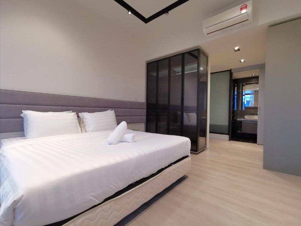 Postel nebo postele na pokoji v ubytování ExpressionZ Suites KLCC