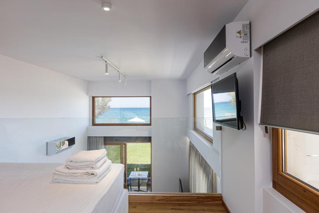 Postel nebo postele na pokoji v ubytování North Coast Seaside Suites