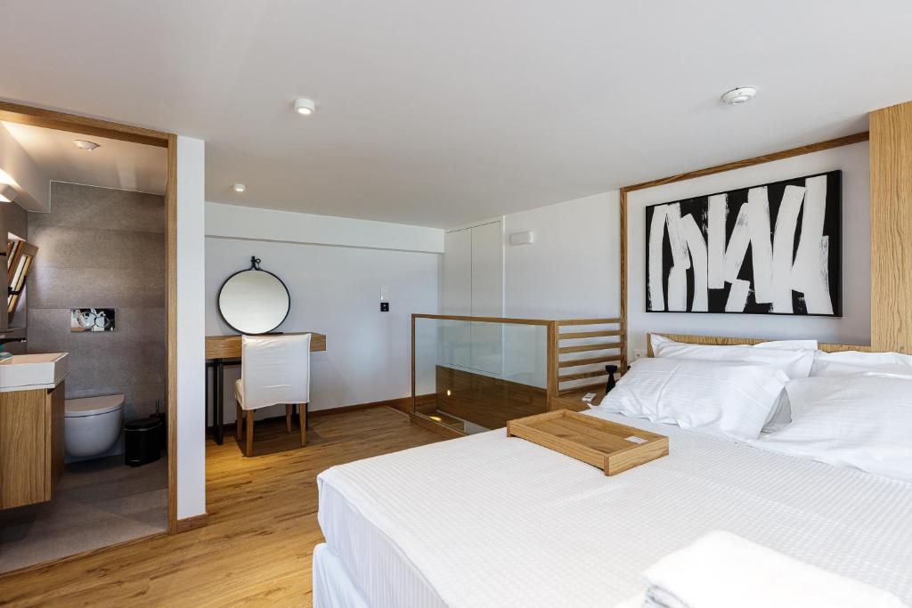 Postel nebo postele na pokoji v ubytování North Coast Seaside Suites