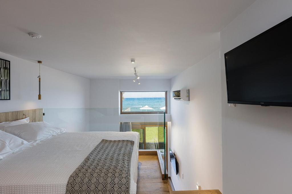 Postel nebo postele na pokoji v ubytování North Coast Seaside Suites